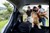 Family with dog in car boot