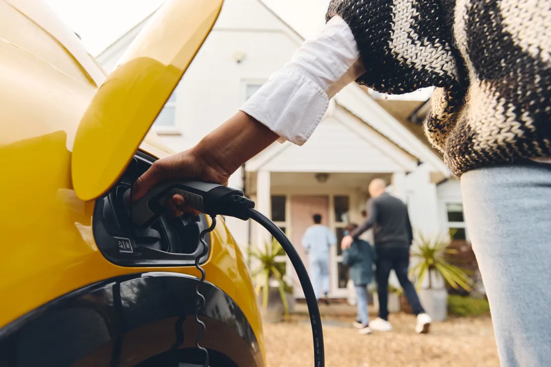 Family Charging Electric Car