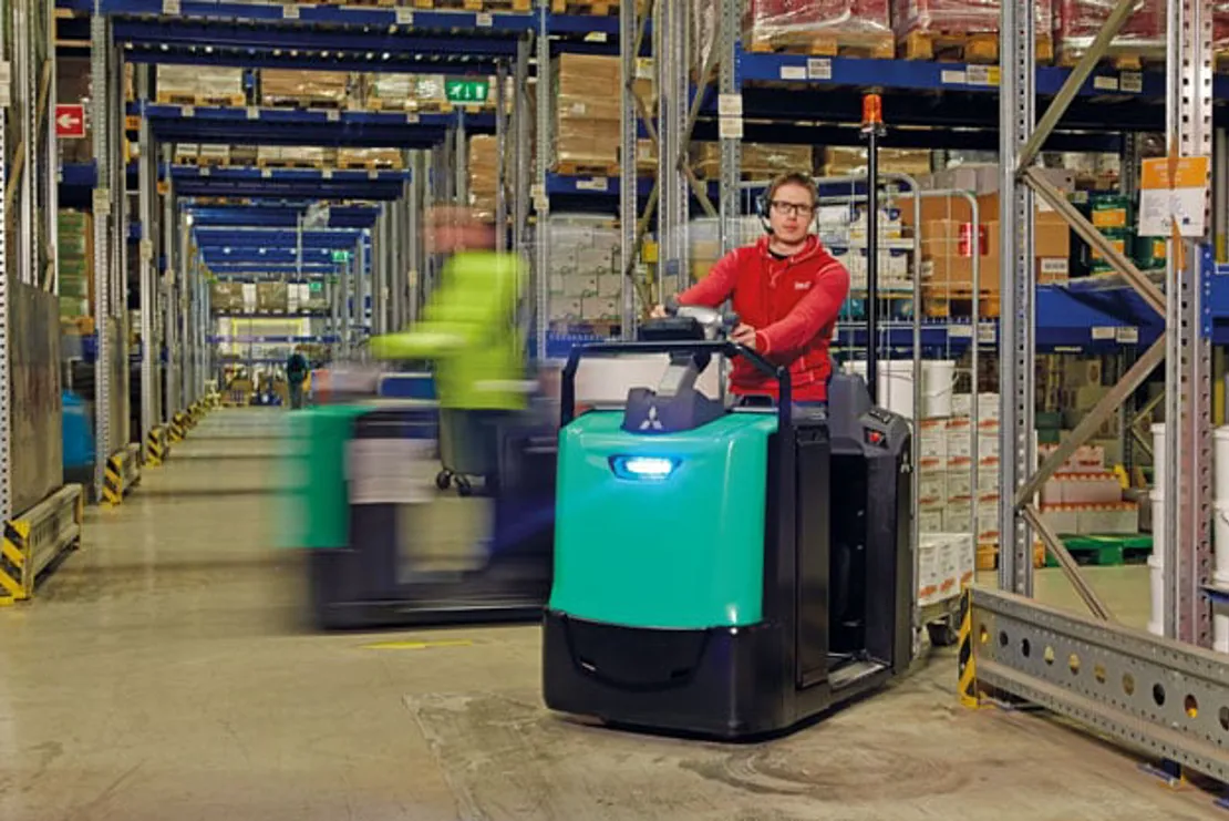 2 forklifts in a warehouse